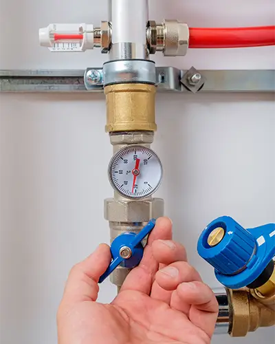 Plumber Checking Water Pressure